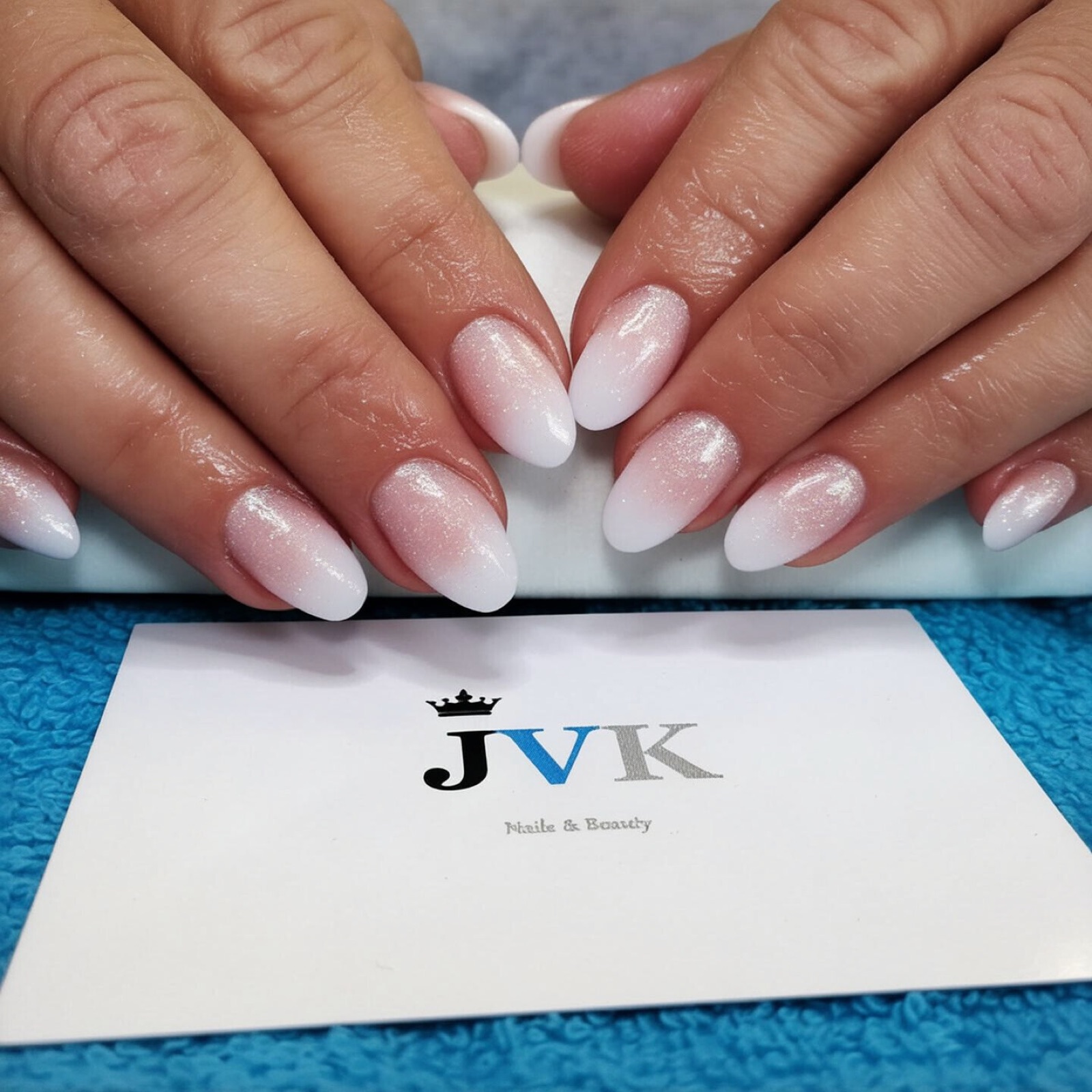 French manicure with feather accent