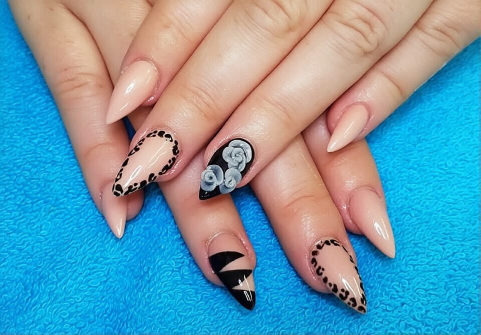 Nude nails with leopard print accent