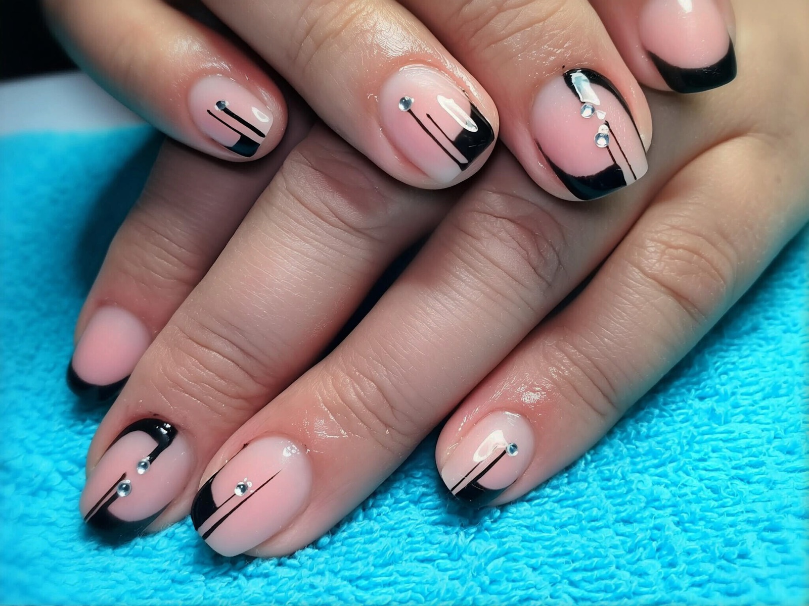 Mauve nails with floral and sunburst accents